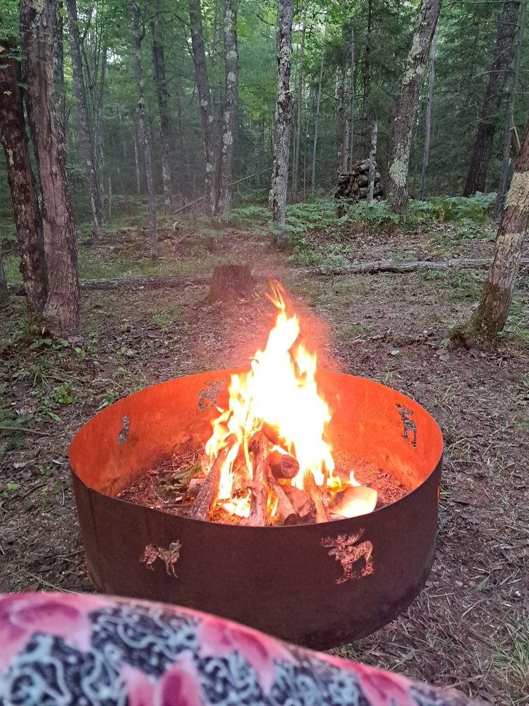 Fire ring with a nice fire up at Queen's Keep in the woods. I certainly hope that felon47 will walk toward the light AKA fires of hell soon.