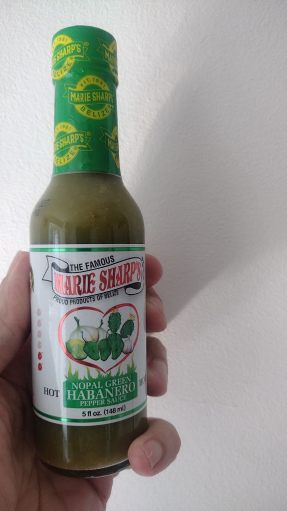 Bottle of green hot sauce. Label reads:
The famous Marie Sharp's
Proud products of Belize
Nopal green habanero pepper sauce
