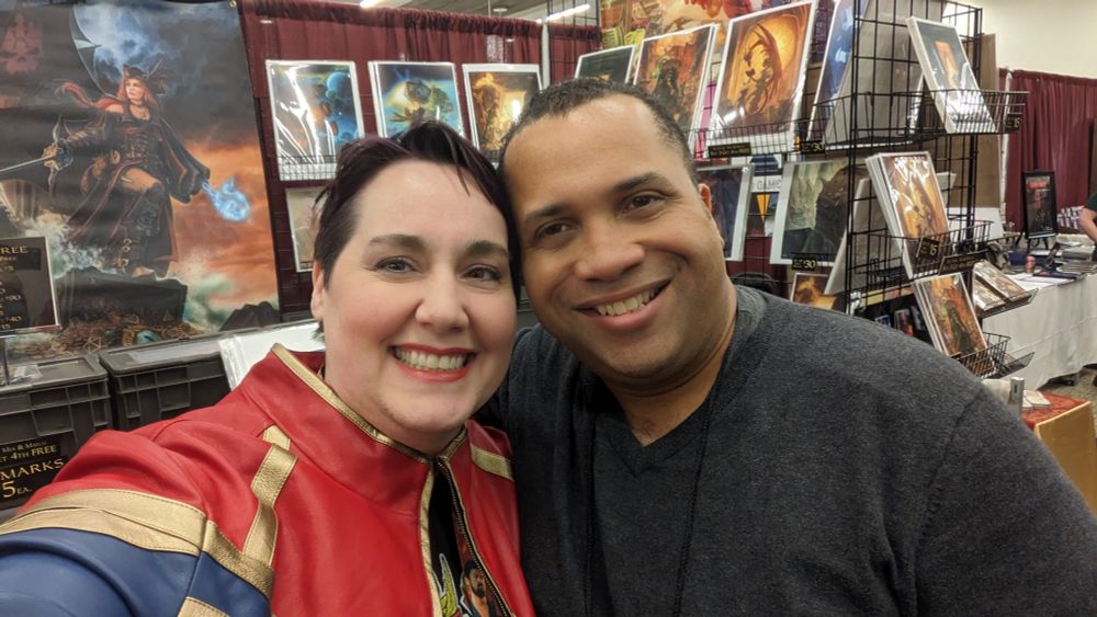 A man and a woman smiling in a selfie.