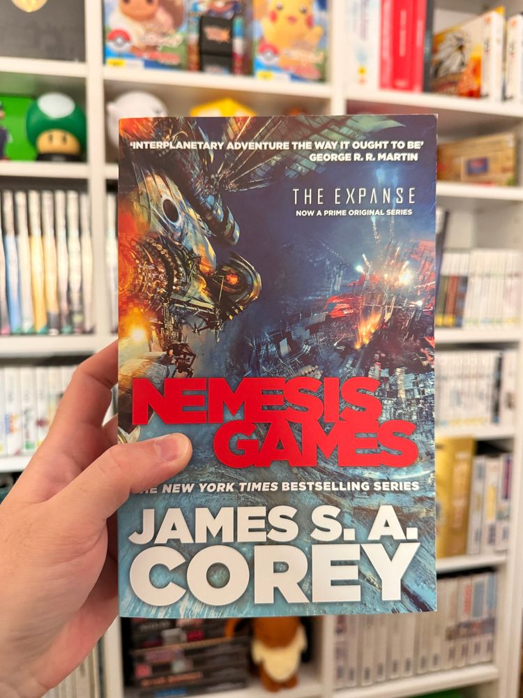 Cover of Nemesis Games by James S. A. Corey, the fifth book in The Expanse series.