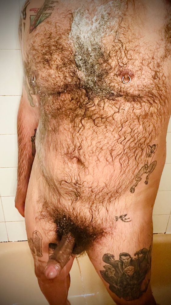 My furry body under the shower spray 