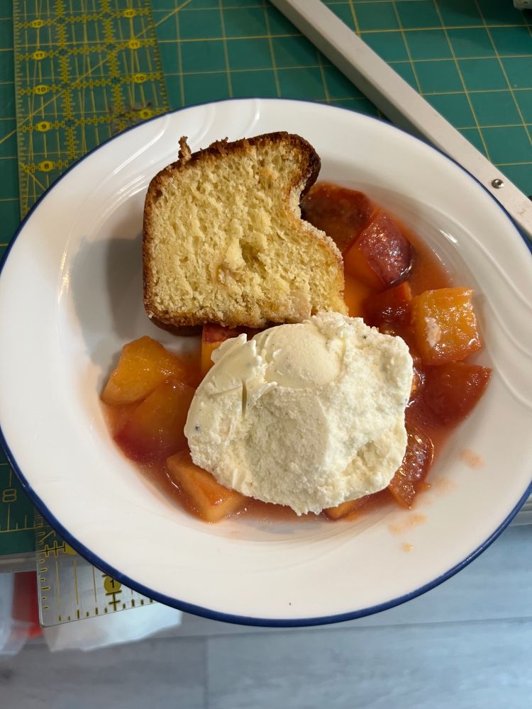 Peach coffee cake with grilled nectarines and a scoop of vanilla ice cream.