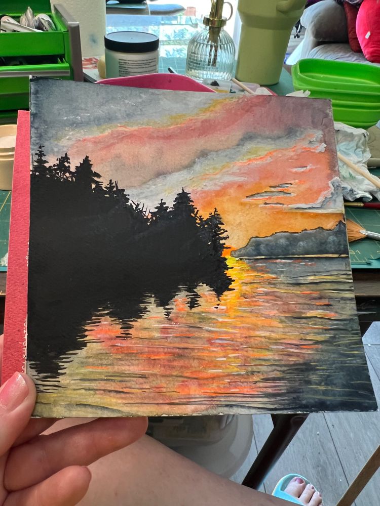 A watercolor painting of a river at dusk.