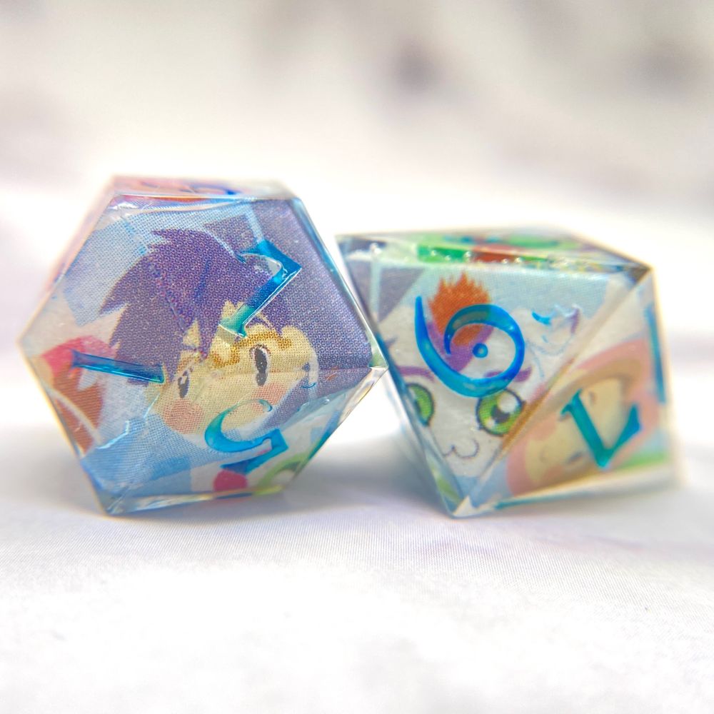 D&D dice featuring the images of the original Digidestined and their partner Digimon.