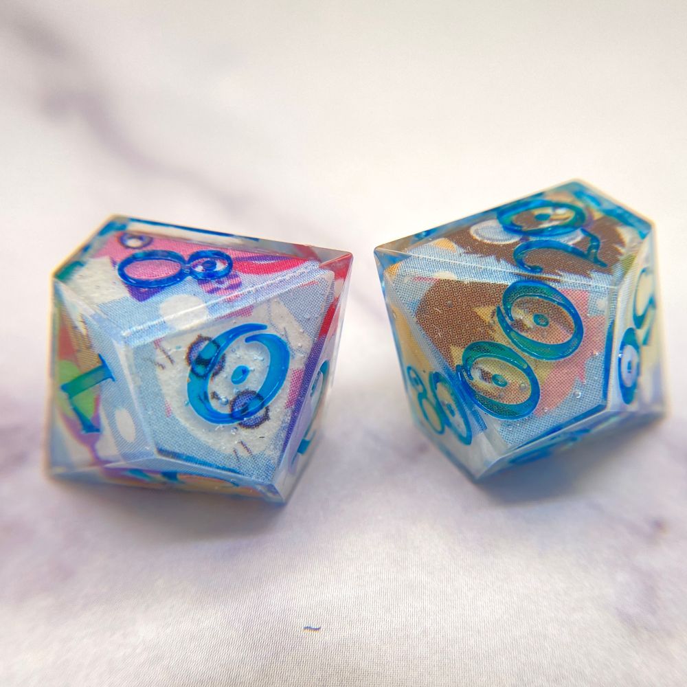 D&D dice featuring the images of the original Digidestined and their partner Digimon.