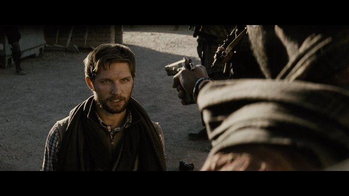 Jimmy Olsen in BvS on his knees about to be executed 