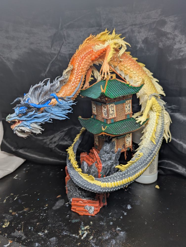Cave dwelling rat snake dragon on temple figurine.