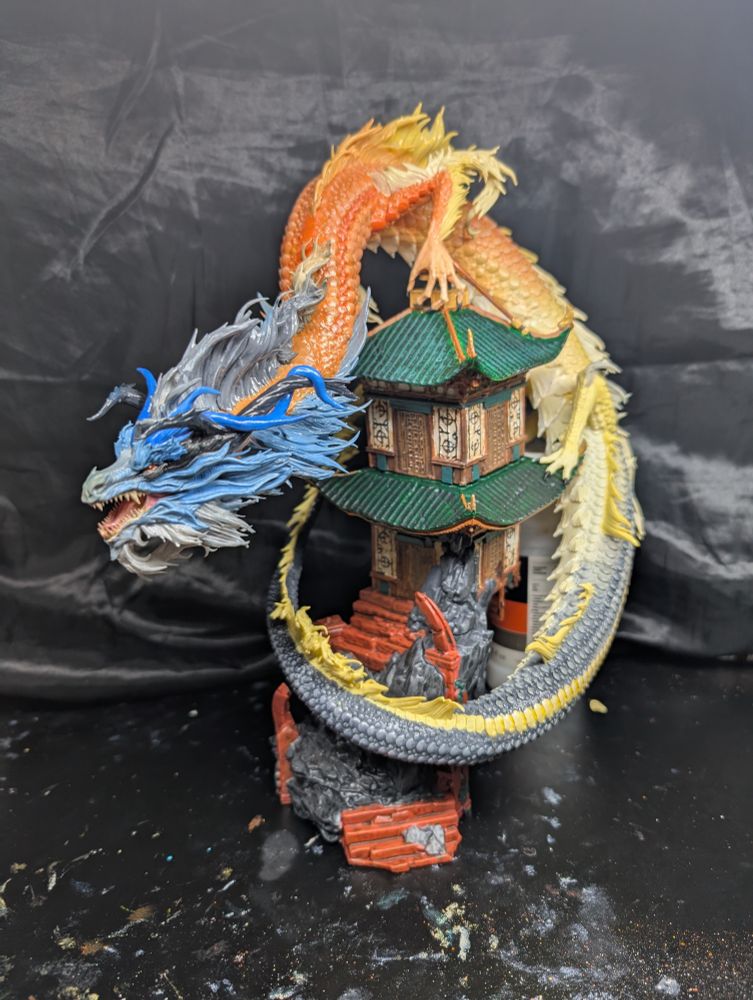 Cave dwelling rat snake dragon on temple figurine.