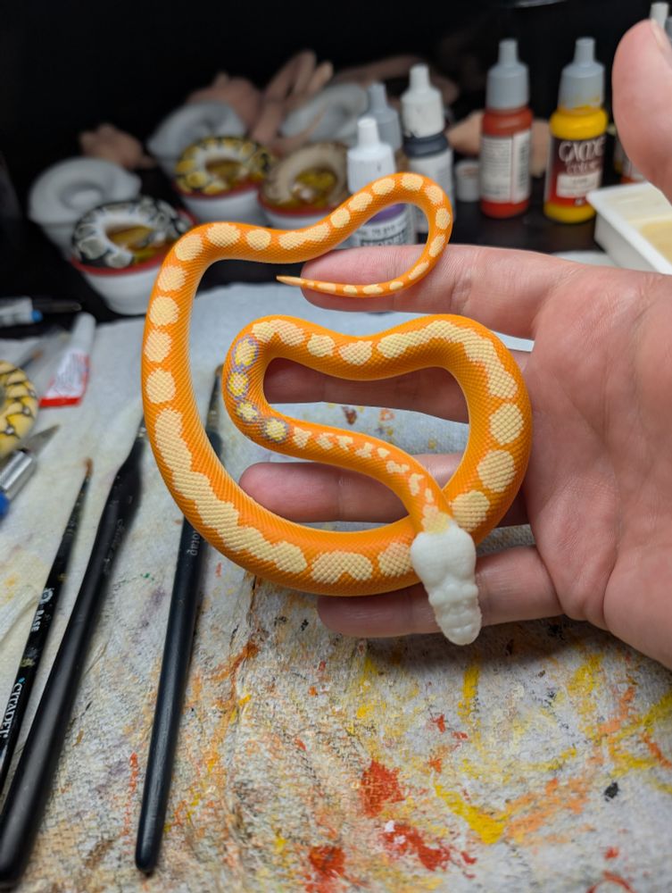 Work in progress, orange reticulated python.
