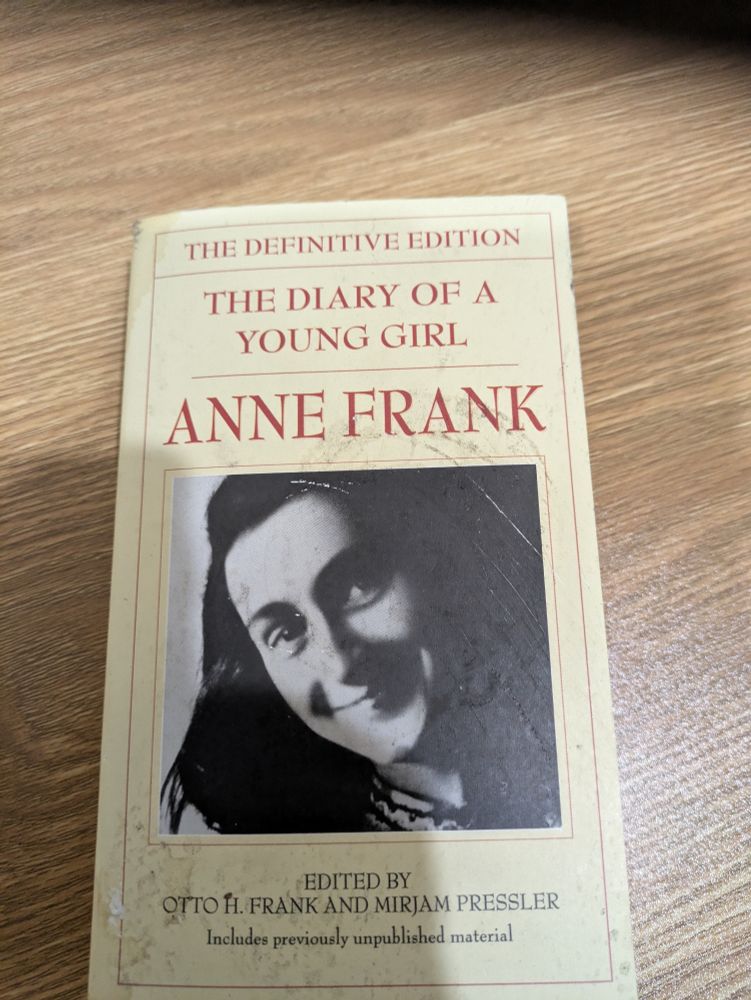 The Definitive Edition of "The Diary of a Young Girl" by Anne Frank, a Jewish teenager who hid with family from the Nazi Regime until betrayed, and died in a Nazi death camp after capture