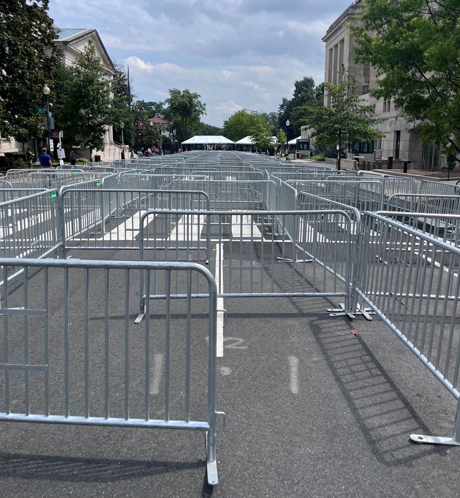 entire block of crowd control barricades arranged to accommodate a long line of people at security, empty 