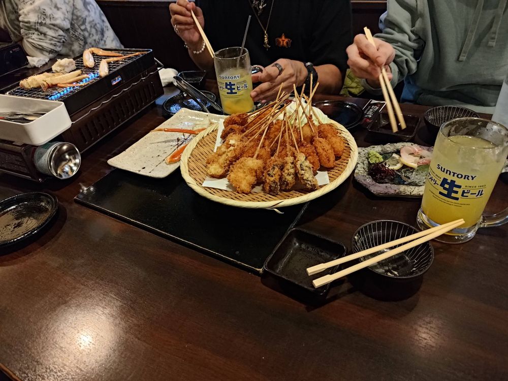 Table of Kushi-age and Alcohol at Kaisen Monogatari in Osaka.