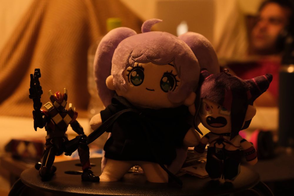 Ultraman figure posed next to Lala (dripped) plush and Juri plush.