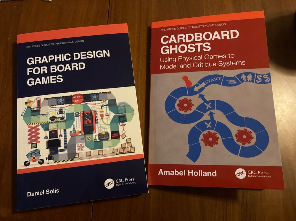 A picture of Cardboard Ghosts by Amabel Holland and Graphic Design for Board Games by Daniel Solis