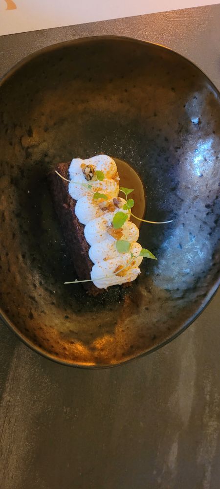 Carrot and walnut cake topped with cream cheese and whisky caramel.