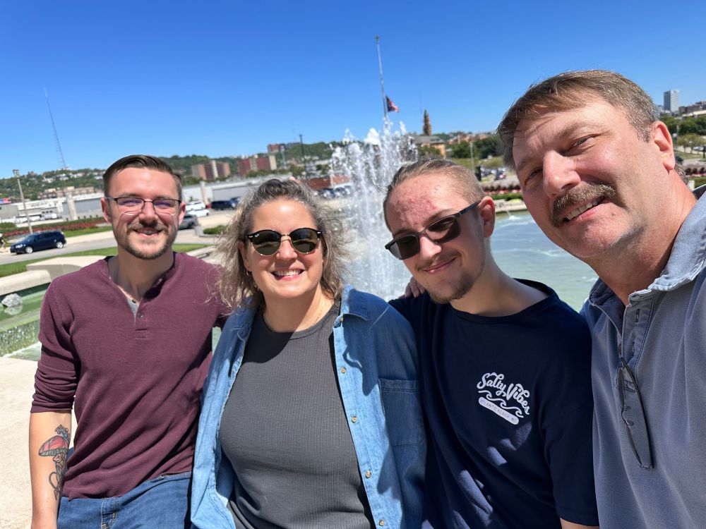A photo of the poster’s family with the fountain in front of the Cincinnati Museum Center behind them. 