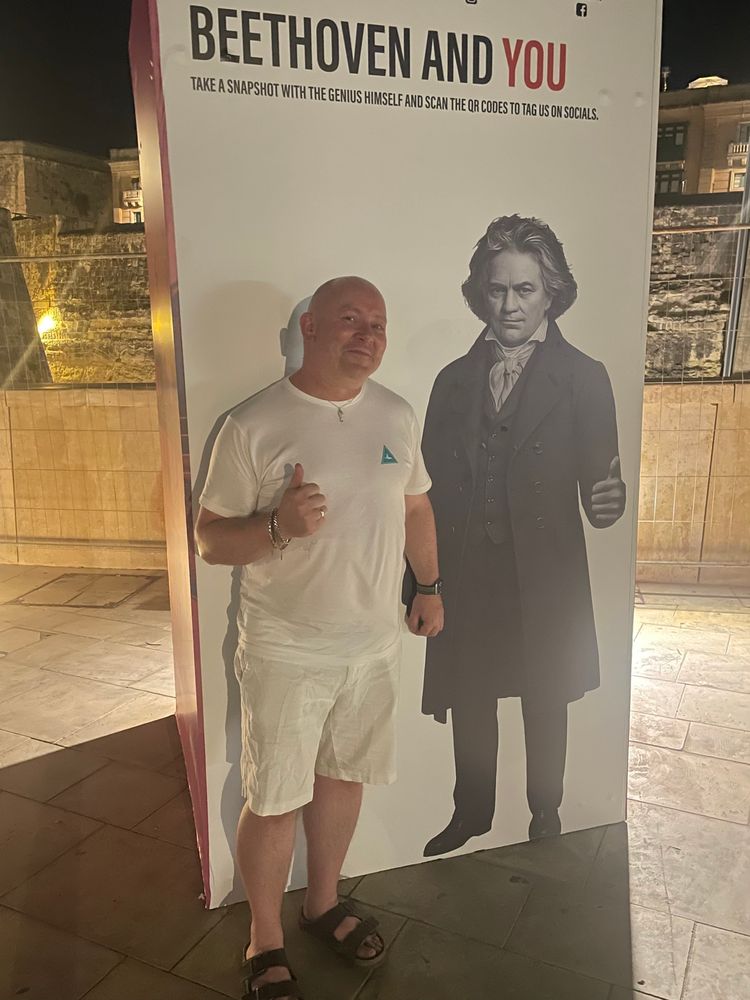 Myself holding the hand of Beethoven (a large flat picture of him) in Valletta