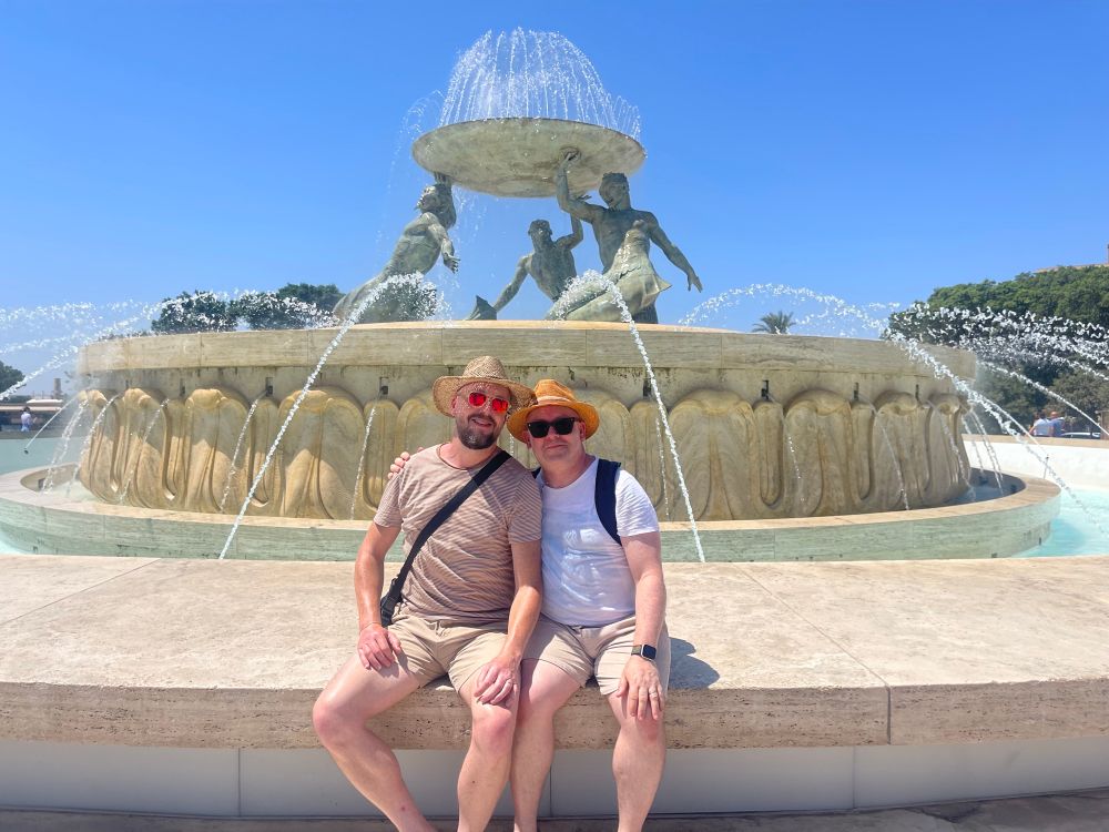 Myself and Greg sitting in front of the Triton Fountain, Valletta