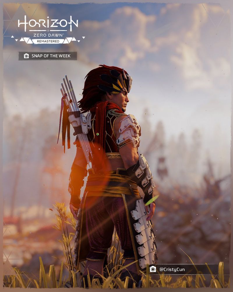 A screenshot taking in Horizon Zero Dawn Remastered of Nil standing with his back to the camera, facing a Bandit Camp that can be seen in the distance. His head is slightly turned so you can see the side of his face.