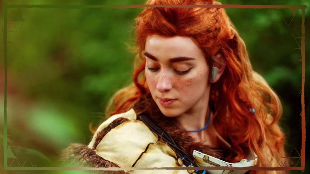 A close-up photo of an Aloy cosplayer looking down to the ground.