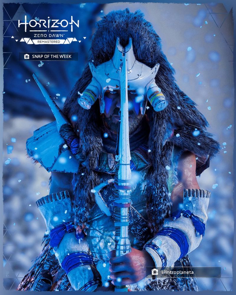 A screenshot taken in Horizon Zero Dawn Remastered of a Banuk tribesman, holding his spear out in front of him, as it covers the middle of his face. He is staring directly into the camera.