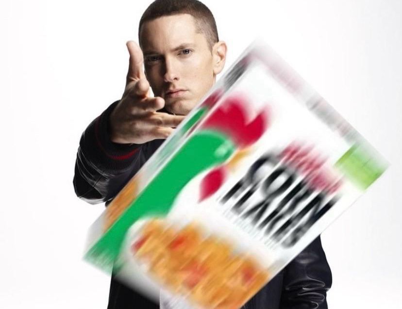 Eminem throwing a box of corn flakes at the viewer