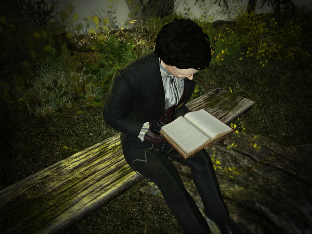 A young man sits on an old and weathered bench to read a book out in the wilderness. The man is dressed in a manner stereotypical of a vampire on a budget, and is holding a drink in his right hand as he holds his book with his left. It is daylight outside, but sufficiently foggy enough to not impede on the vampire's day out. His glasses are barely even visible in the photo, but I'll mention them anyway.