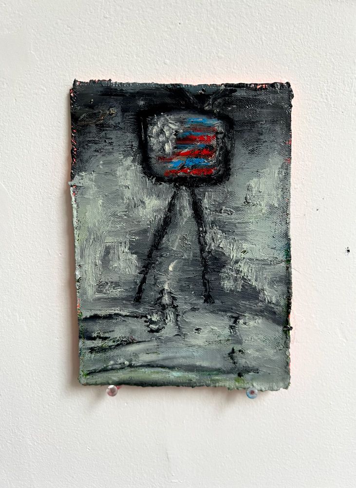 A small oil stick on board. An old tv stands in the middle of a black and white background with a disrupted American flag on the screen. A man’s body lays below the tv with an erect penis and jizz spraying out