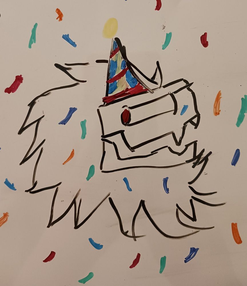 Whiteboard doodle of OP's sona/OC wearing a party hat and surrounded by confetti