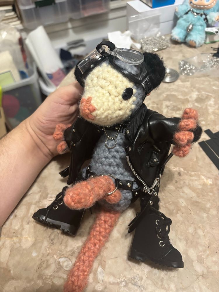 Another angle. He is wearing a cock ring necklace and a chest harness too but its hard to see under his big fuckin head