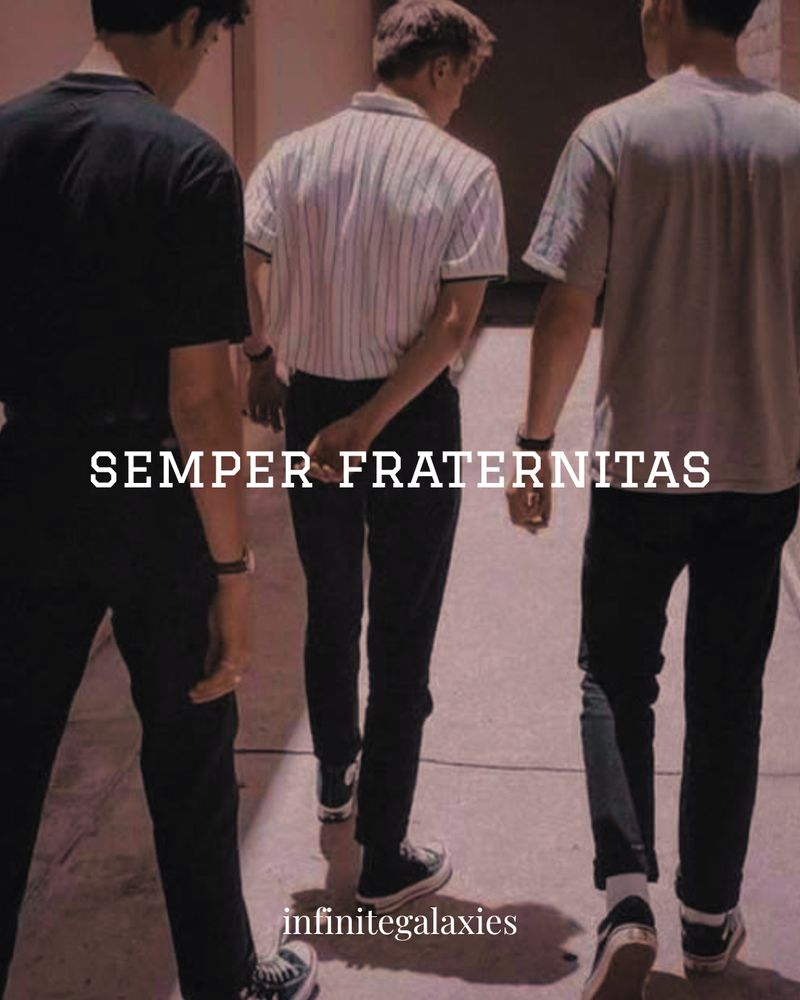 semper fraternitas infinitegalaxies image of three young short-haired white men walking down the alleyway, on ein all black one with a white striped short sleeve collard shirt and the other in a gray shirt and jeans. two are wearing chuck taylors and one is wearing vans