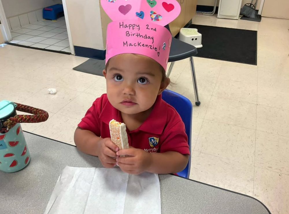 Photo of OP’s niece holding a snack while wearing her birthday crown. 