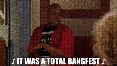 Tituss Burgess, a black man in a red cardigan, claps from side to side while singing “It was a total bangfest.” 

From the US sitcom The Unbreakable Kimmy Schmidt. 
