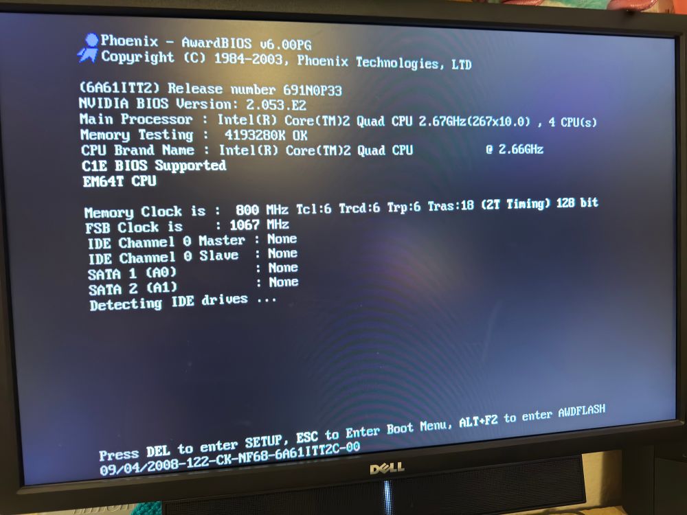 The BIOS screen (showing a Core 2 Quad Q6600)