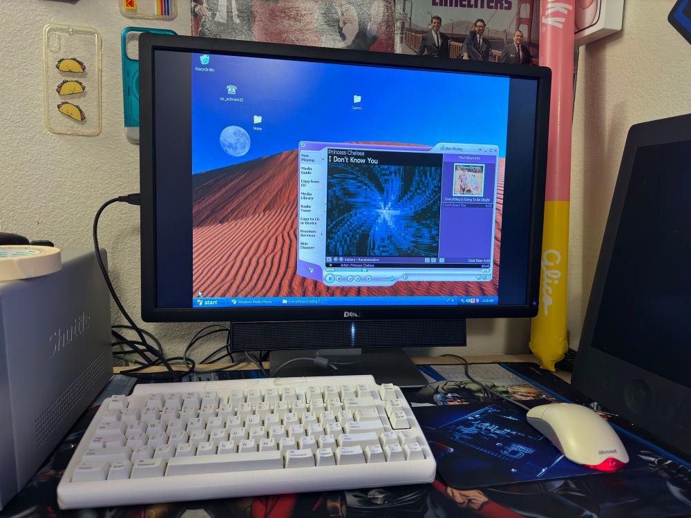 The Shuttle at the XP desktop with the XP Embedded theme and built in desert wallpaper. It is playing Princess Chelsea’s “I Don’t Know You” in WMP9