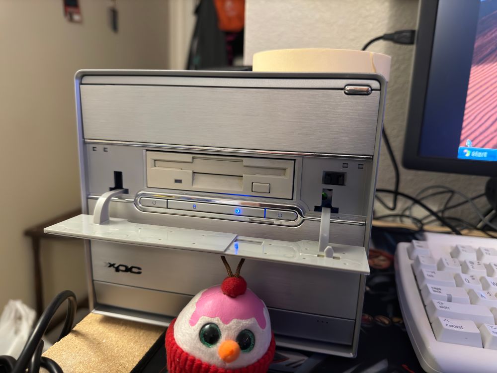 The Shuttle’s door open to reveal a floppy drive