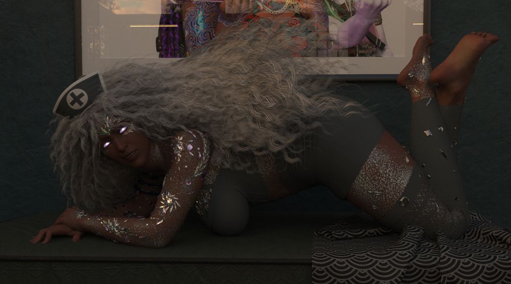 Jazza is propped up on her knees and elbows as she looks at the viewer. Her arms and legs cross as she has a slightly less angry expression for the viewer. 
