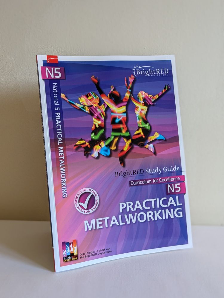 A photo of Bright Red's new N5 Practical Metalworking Study Guide. The cover is purple, with three people jumping in the centre.