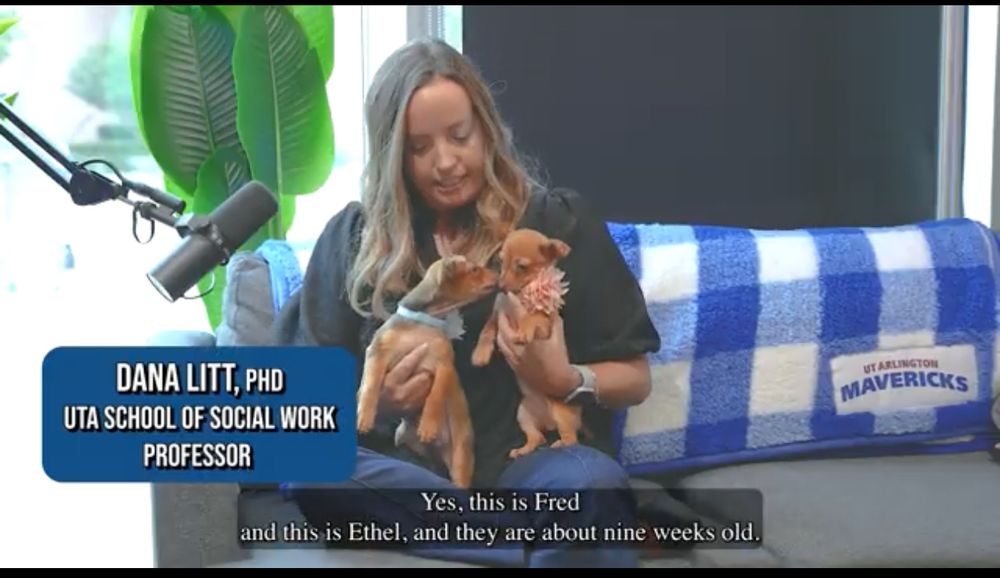Woman holding two puppies 