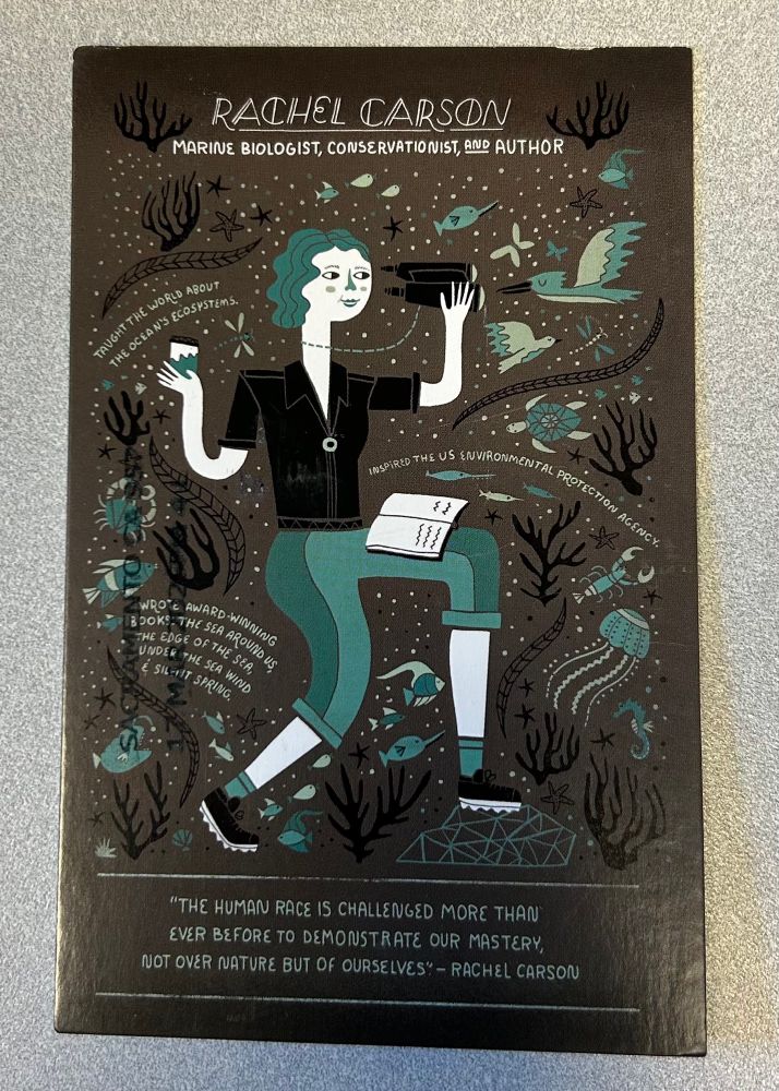 Illustration of Rachel Carson with cool things swirling around her - jellyfish, birds, turtles. She is holding binoculars and a water sample and a field notebook. Quote below her reads: 

“The human race is challenged more than ever before to demonstrate our mastery, not over nature but of ourselves.”