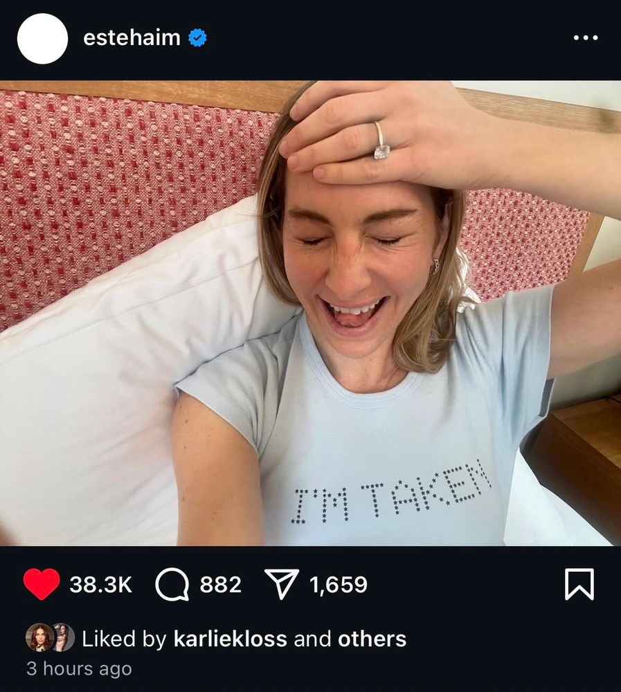 Este haim Insta post wearing a “I’m taken” shirt 