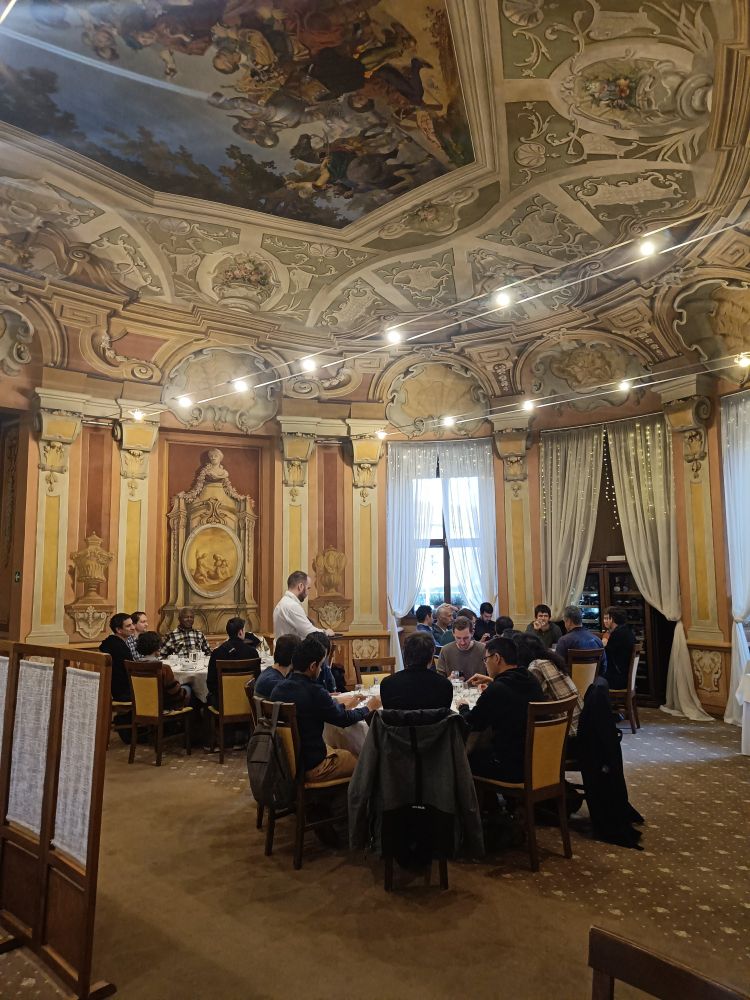 Group dinner in one of the rooms of the Liblice palace