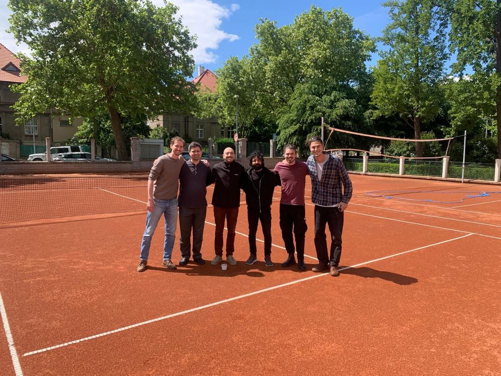 The experimental team at Nanosurf lab + Stefano Trivini gathered on the tennis court at the Institute of Physics of the Czech Academy of Sciences.