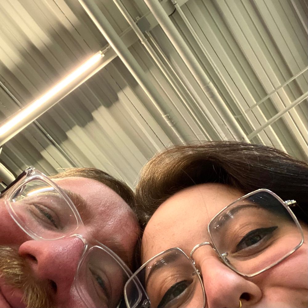 a photo of Happy and Hoobsie from the nose up, peaking at the camera.