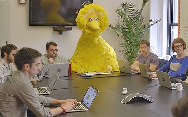 Big bird in a “serious” boardroom meeting