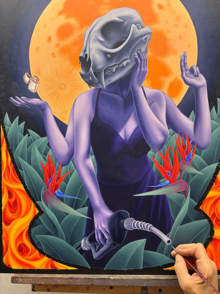 Oil painting in progress of a woman with a lynx skull for a head, with 4 arms. One hand is holding a hose from a gas pump, one hand is on her cheek, one holds up 2 fingers, one is palm up with a zippo lighter floating just above. She is surrounded by plants and bird of paradise flowers. The full moon rises behind her.