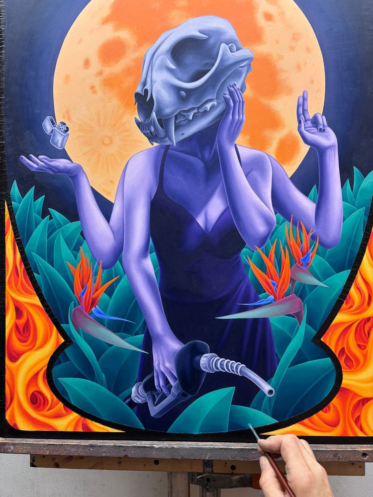 Oil painting in progress of a woman with a lynx skull for a head, with 4 arms. One hand is holding a hose from a gas pump, one hand is on her cheek, one holds up 2 fingers, one is palm up with a zippo lighter floating just above. She is surrounded by plants and bird of paradise flowers. The full moon rises behind her.