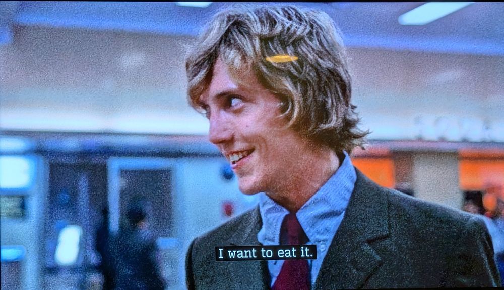 Continuing his thought, he says "I want to eat it" while grinning giddily 