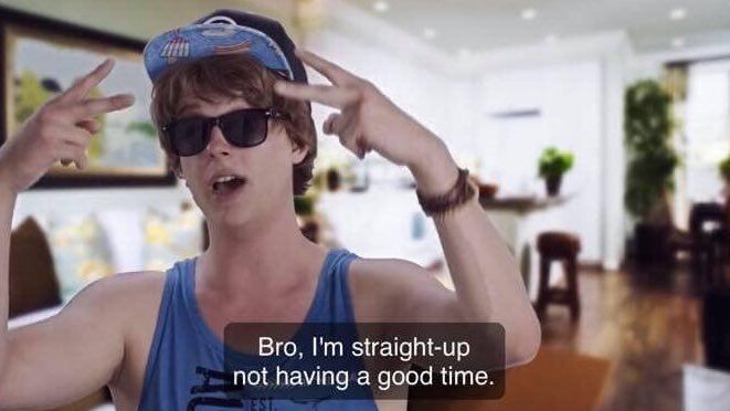 A meme of a young man in a blue tank top, hat, and sunglasses, with a caption that says "Bro, I'm straight up not having a good time."