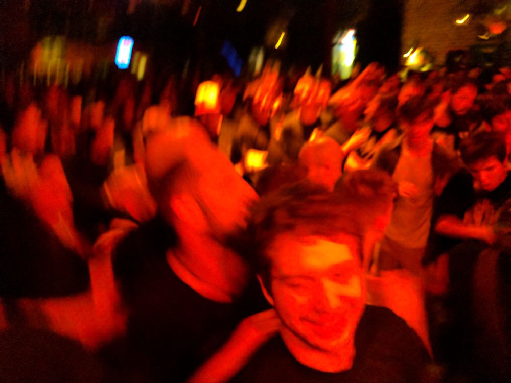 A red-orange-tinged, blurry action photo of a bunch of young men at a concert.
The pit for Red Fang at Slim's in SF, 2016-11-18.  Whores. and Torche opened.  My friend did coke in the basement with a roofer we met at the bar.  Absolutely killer show.